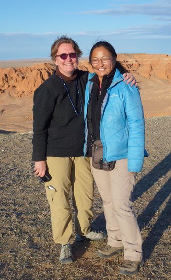 Rebecca Hintz (left) with Mongolian guide Aaza at the Flaming Cliffs