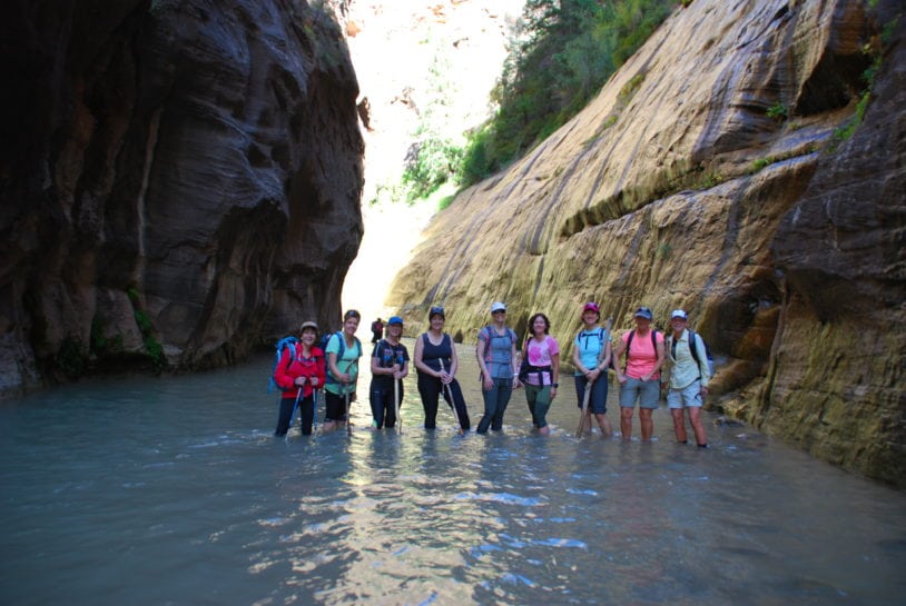 women hiking Narrows Canyon with AdventureWomen in Zion