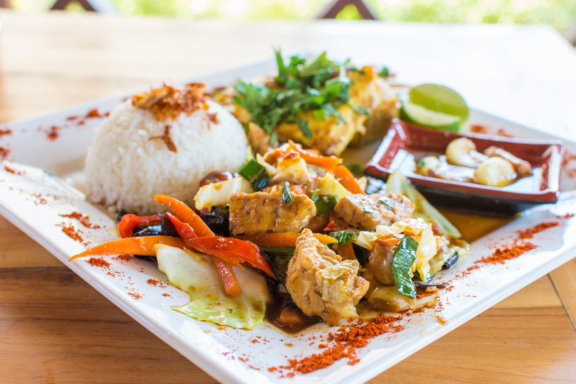 Traditional Balinese cuisine. Vegetable and chicken stir-fry with rice.