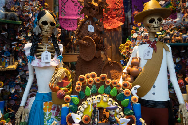 Dias de los muertos figures on display window in a store, San Miguel De Allende, Mexico