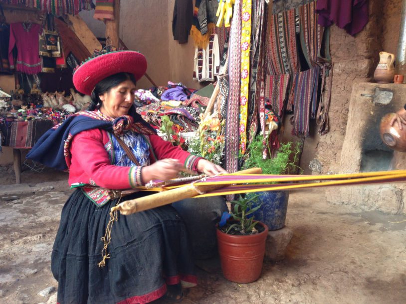 Peruvian woman making colourful rope