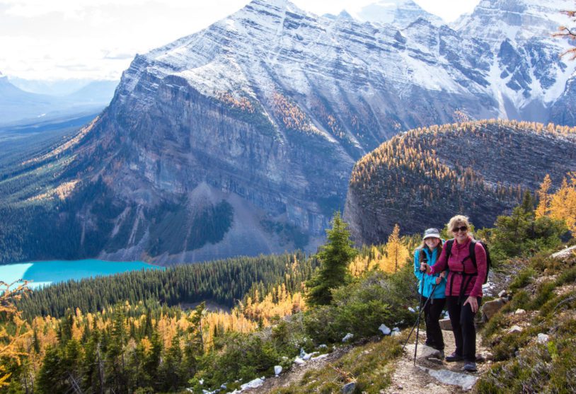 Two women high up on a trail above Banff Lake