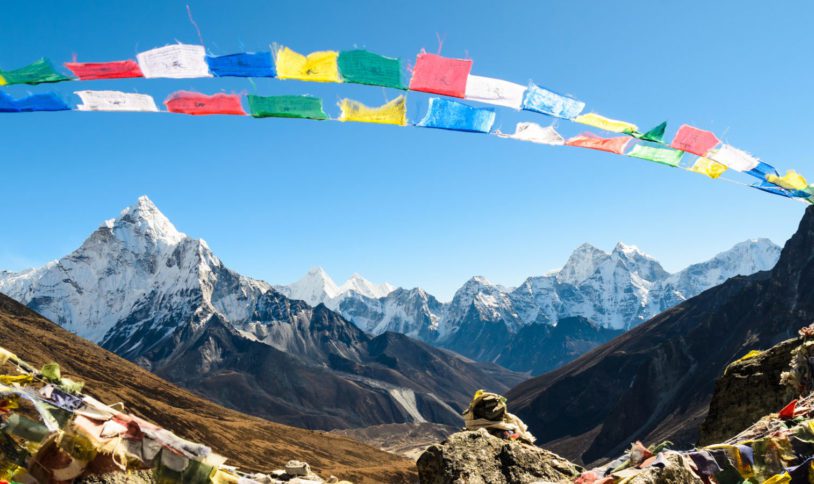 Ama Dablam framed with praying flags in Himalaya, Nepal.