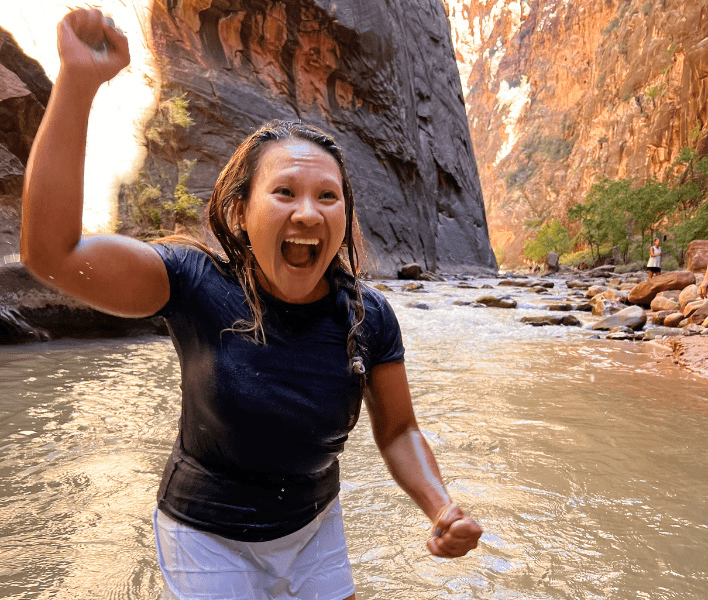 AdventureWomen guest conquering the Narrows in Utah