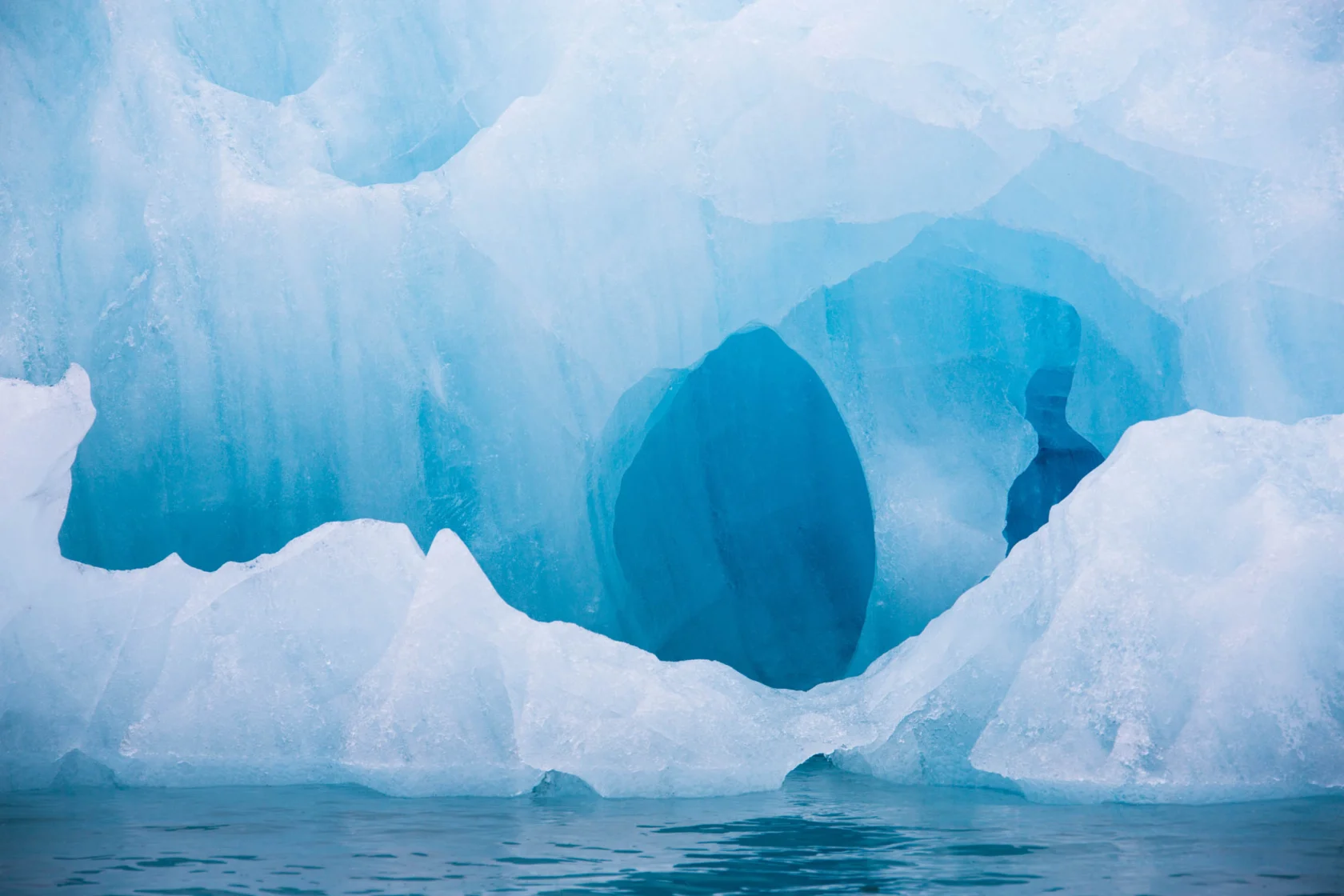 Blue iceberg floating in the Hornsund Spitzbergen.