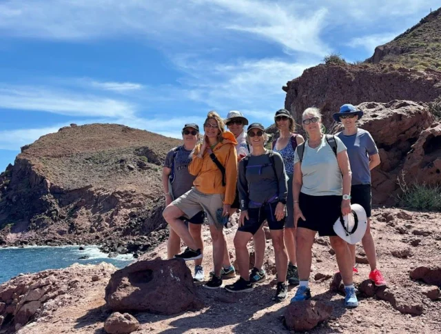 A group of women by the ocean.