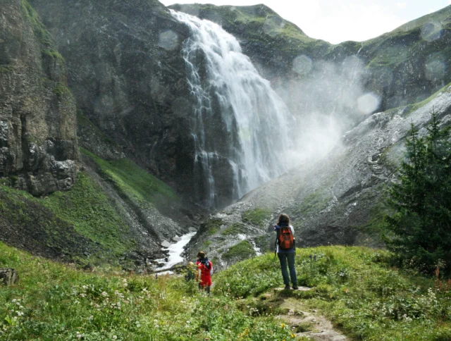 Hikers looking at the Engstligen falls in Switzerland